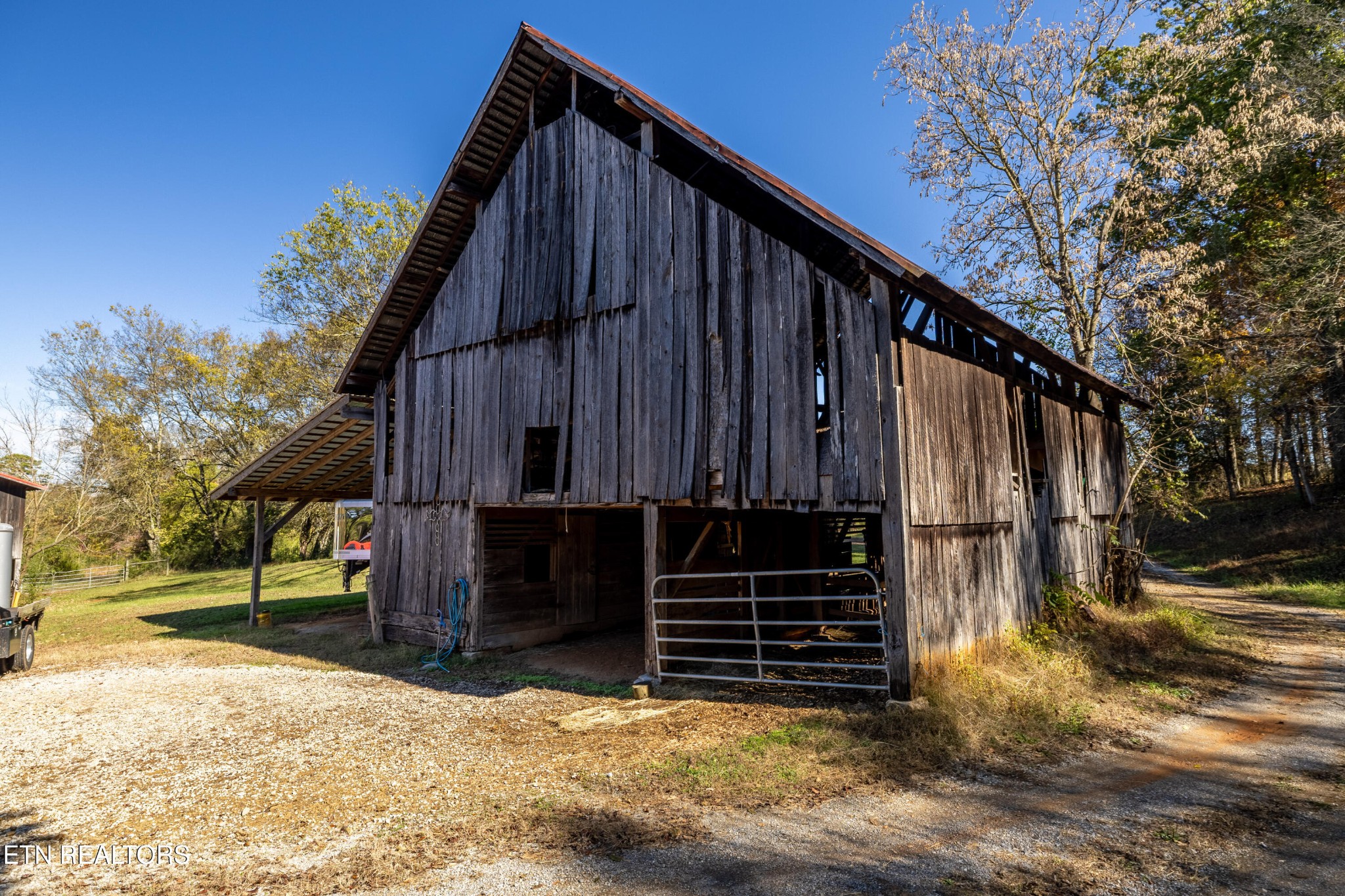 3070 West Fork Road Loudon, TN 37774 - Photo 40 of 48 a view of house with wooden fence next to a road