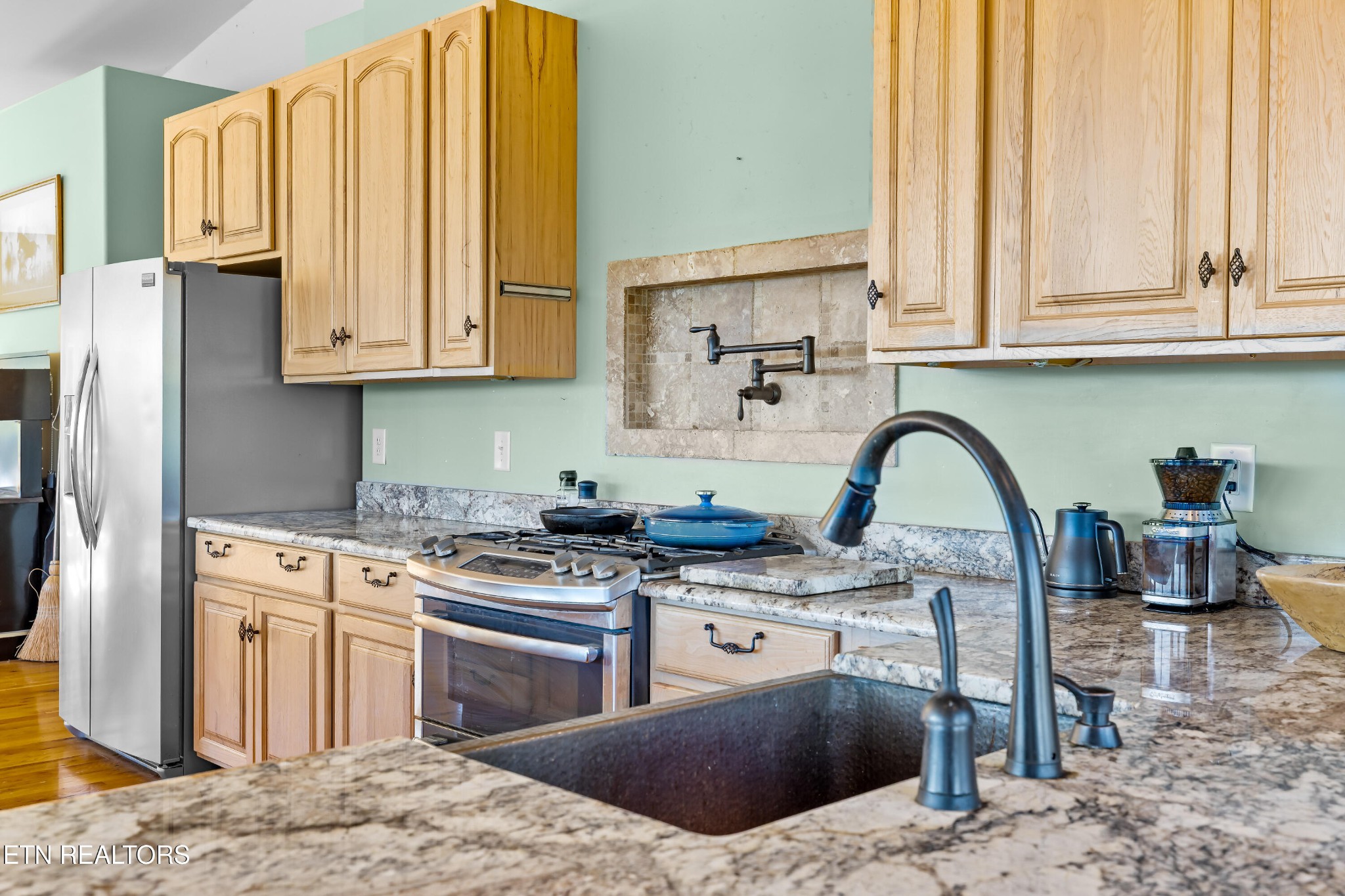 3070 West Fork Road Loudon, TN 37774 - Photo 10 of 48 a kitchen with stainless steel appliances granite countertop a stove a sink and a refrigerator
