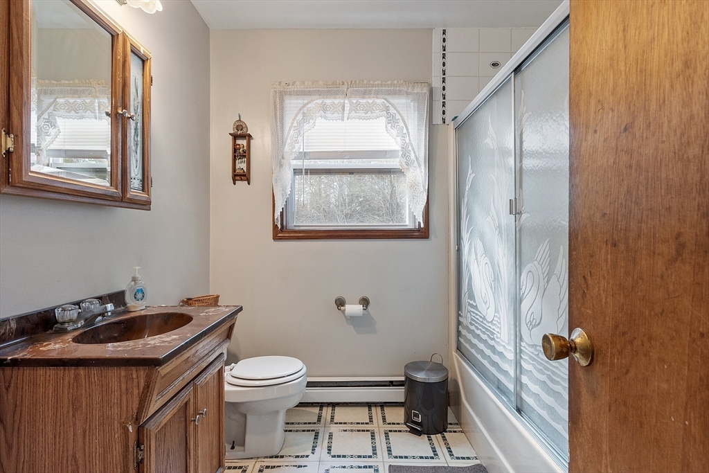 321 Doe Valley Road Athol, MA 01331 - Photo 12 of 31 a bathroom with a sink a toilet and mirror