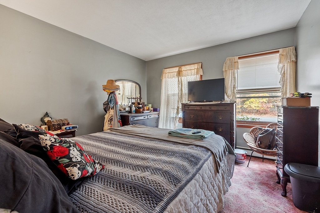 321 Doe Valley Road Athol, MA 01331 - Photo 13 of 31 a bedroom with a bed and wooden floor