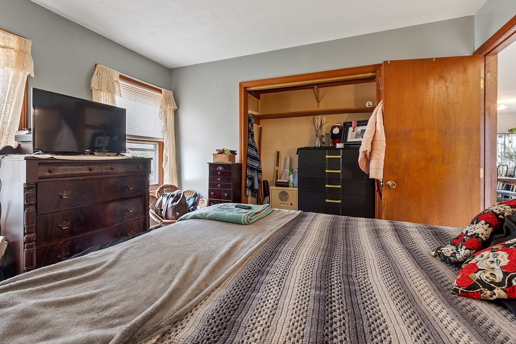 321 Doe Valley Road Athol, MA 01331 - Photo 14 of 31 a bedroom with a bed and a flat tv screen on dresser