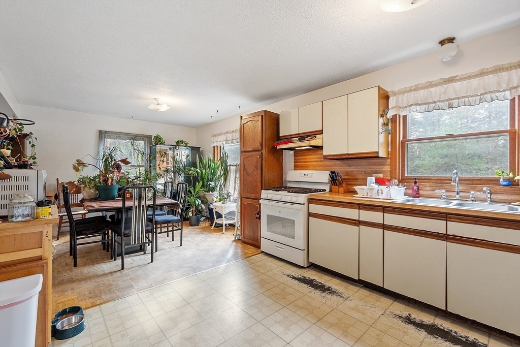 321 Doe Valley Road Athol, MA 01331 - Photo 16 of 31 a kitchen with sink cabinets and outdoor view