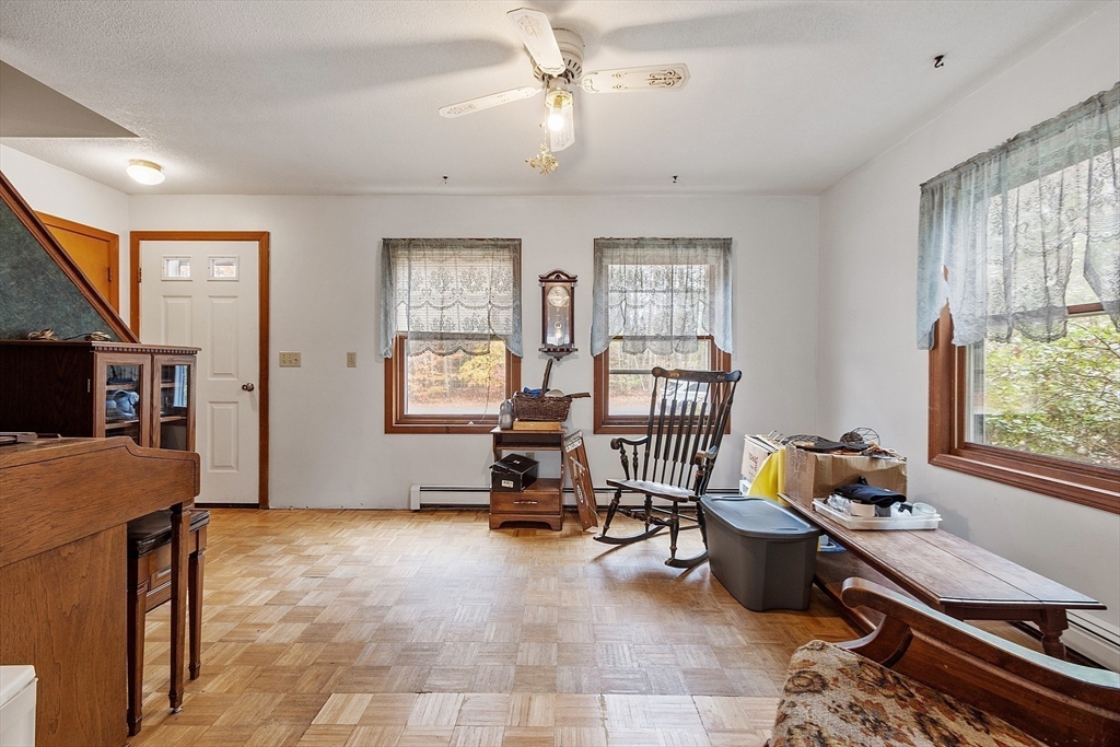 321 Doe Valley Road Athol, MA 01331 - Photo 20 of 31 a living room with furniture gym equipment and a window