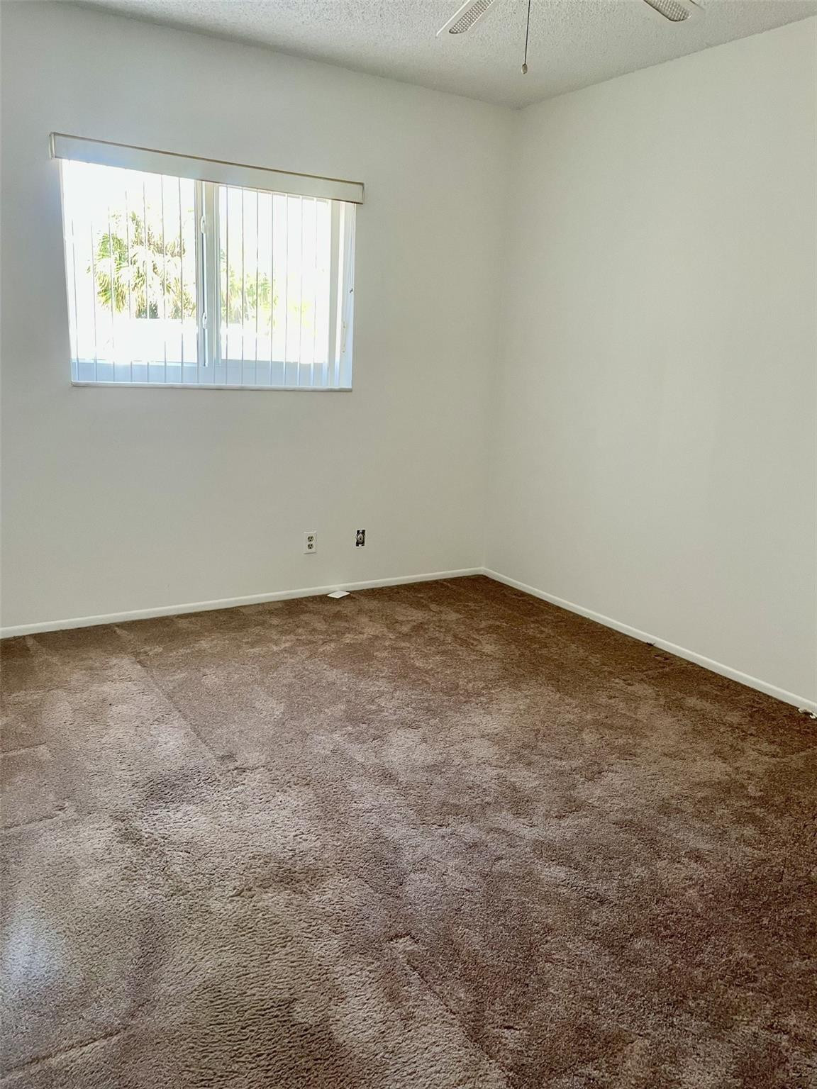 424 North Riverside Drive, Unit 102 Pompano Beach, FL 33062 - Photo 11 of 16 an empty room with a window
