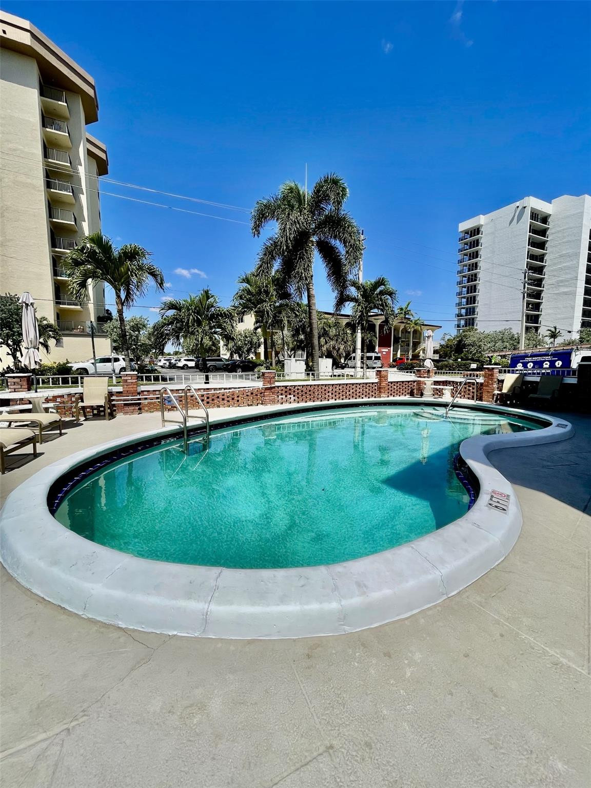 424 North Riverside Drive, Unit 102 Pompano Beach, FL 33062 - Photo 16 of 16 a view of a swimming pool with a yard and a fountain