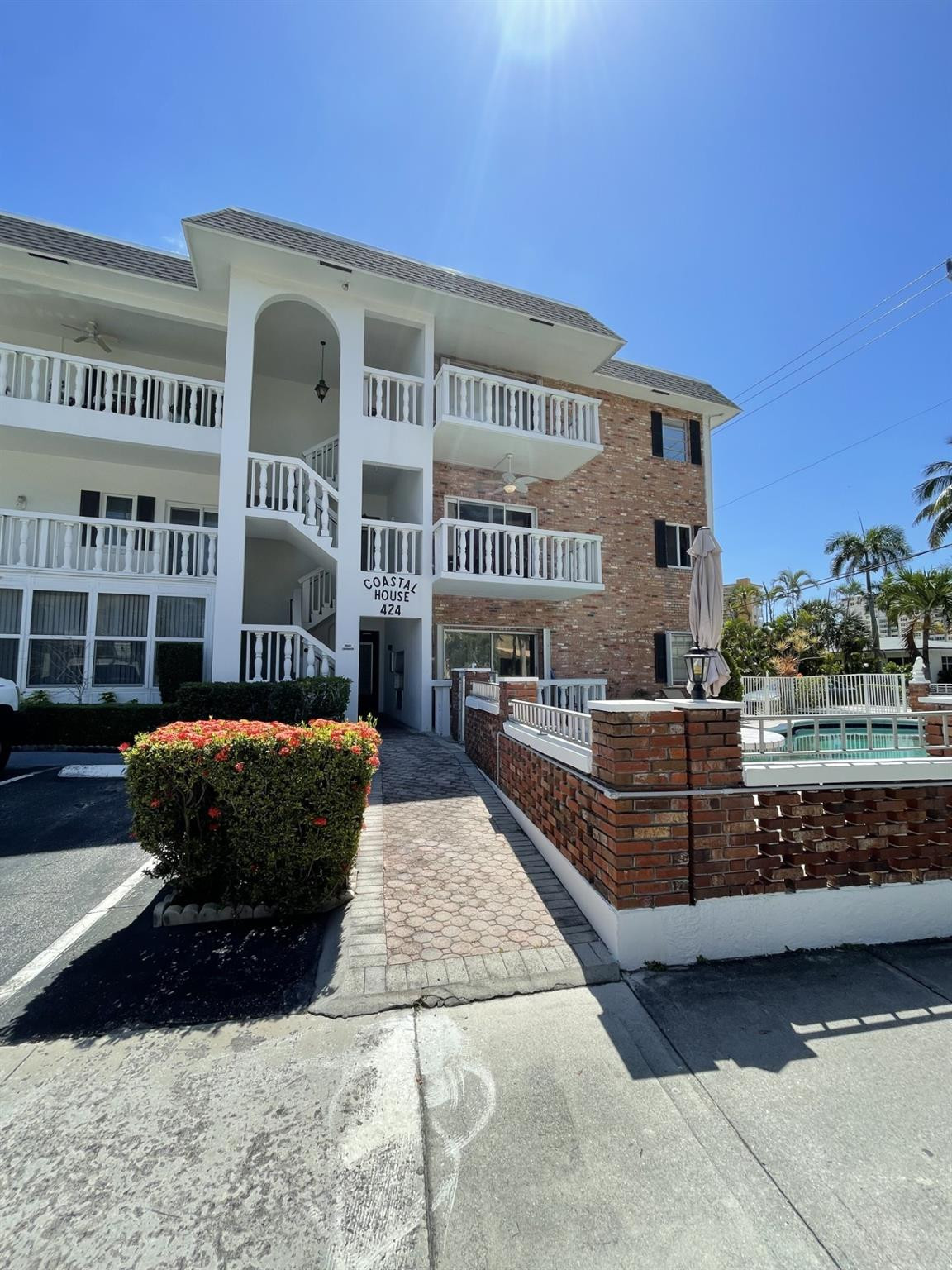 424 North Riverside Drive, Unit 102 Pompano Beach, FL 33062 - Photo 2 of 16 a view of a building with sitting area