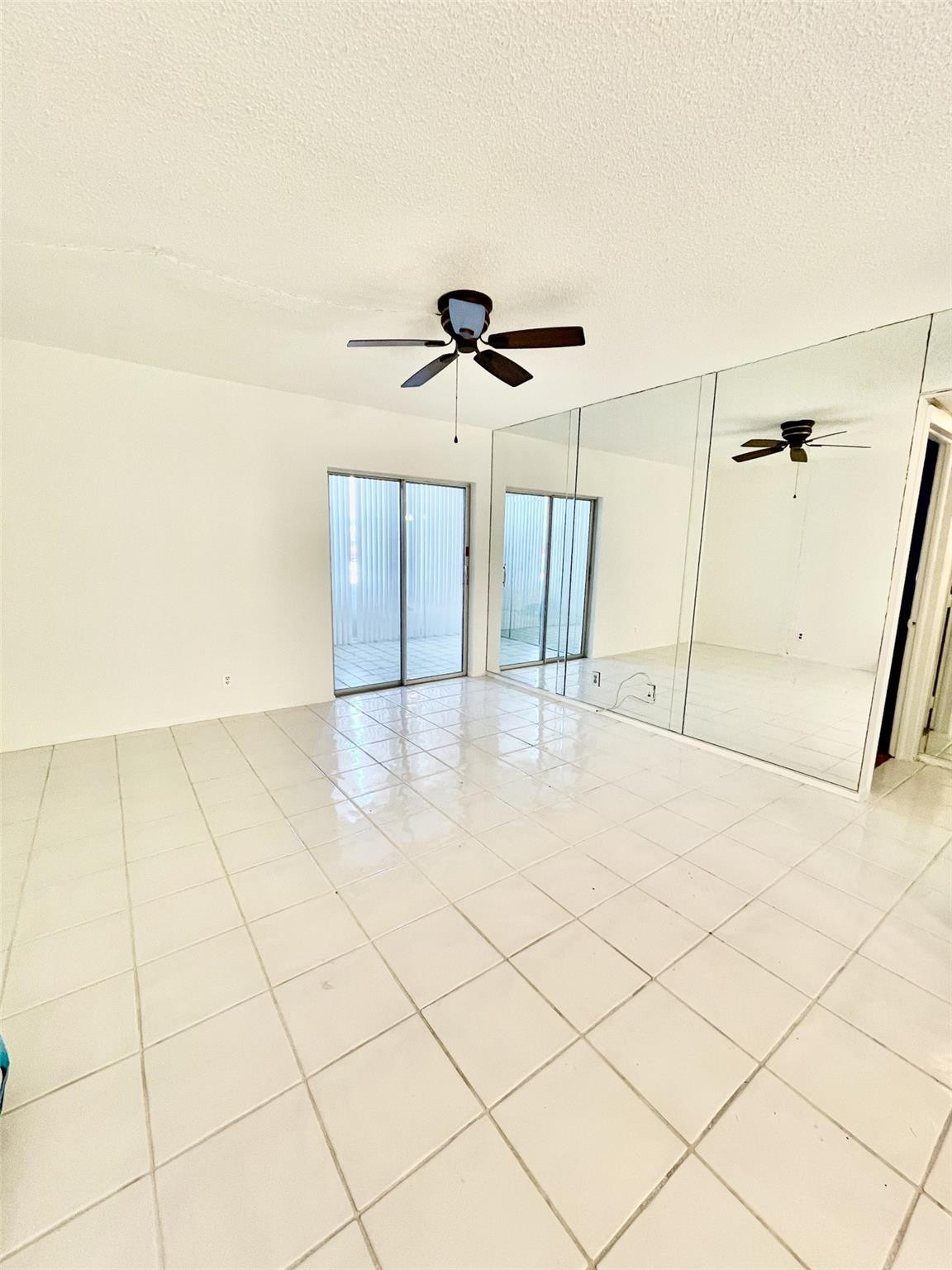 424 North Riverside Drive, Unit 102 Pompano Beach, FL 33062 - Photo 6 of 16 a view of a livingroom with wooden floor