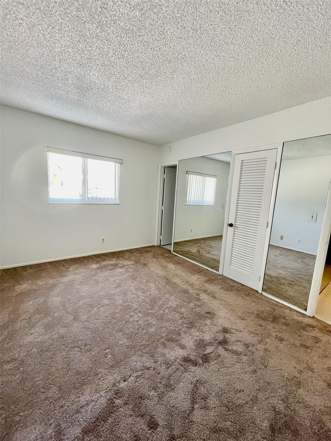 424 North Riverside Drive, Unit 102 Pompano Beach, FL 33062 - Photo 8 of 16 an empty room with a natural light