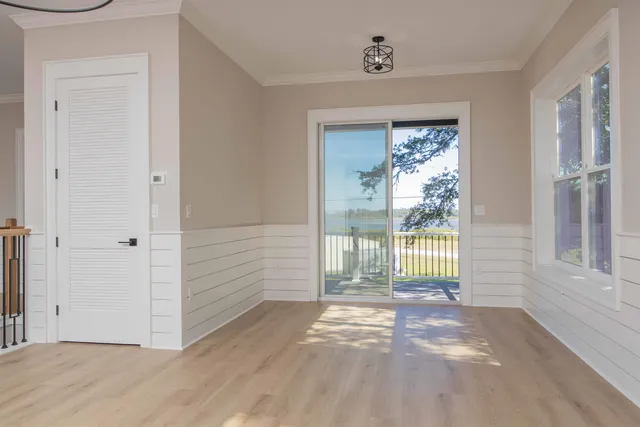 a view of a balcony with wooden floor