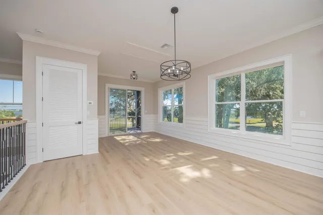 a view of a livingroom with a ceiling fan and window