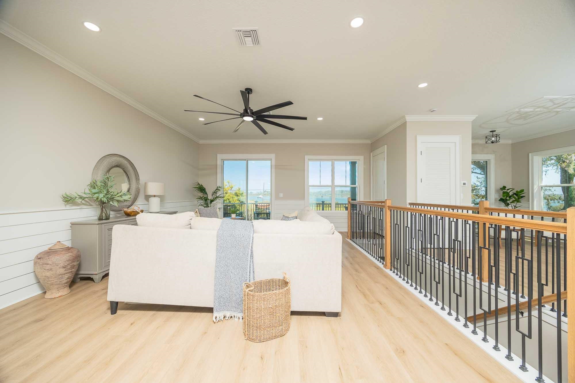 132 Terrapin Road St. Augustine, FL 32086 - Photo 22 of 95 a living room with a couch and a chandelier