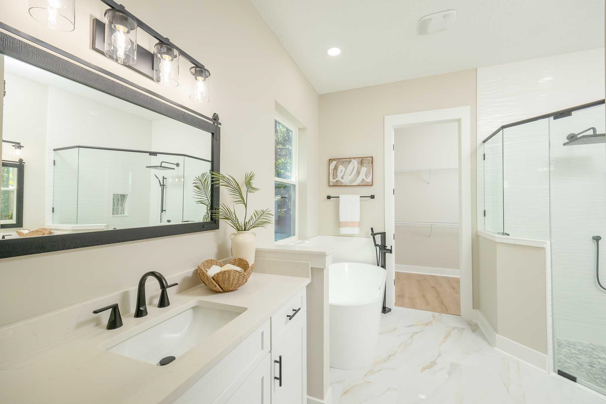 132 Terrapin Road St. Augustine, FL 32086 - Photo 71 of 95 a bathroom with a double vanity sink mirror and shower