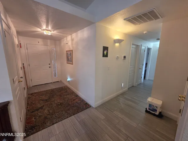 a view of livingroom with hardwood floor and a ceiling fan
