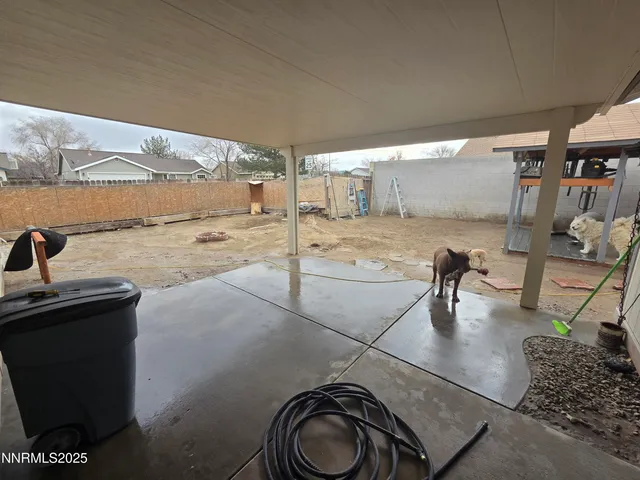a dining room with a table and chairs
