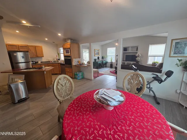 a view of a kitchen with dining table and chairs