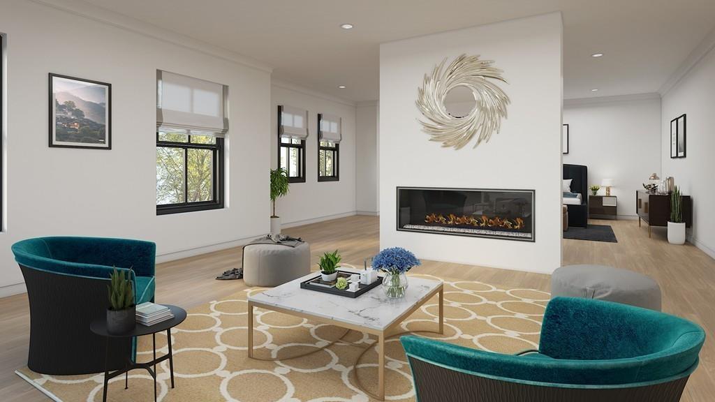 68 Freemont Street Lexington, MA 02421 - Photo 6 of 11 a living room with furniture a flat screen tv and a fireplace