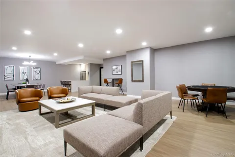 a living room with furniture and a piano
