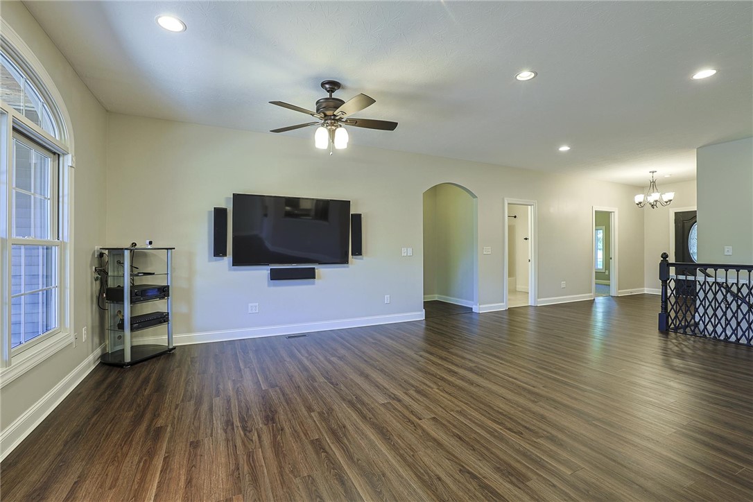 3681 Wilmington Road Lebanon, OH 45036 - Photo 4 of 87 This expansive living area features luminous recessed lighting and rich hardwood flooring, creating an inviting ambiance.