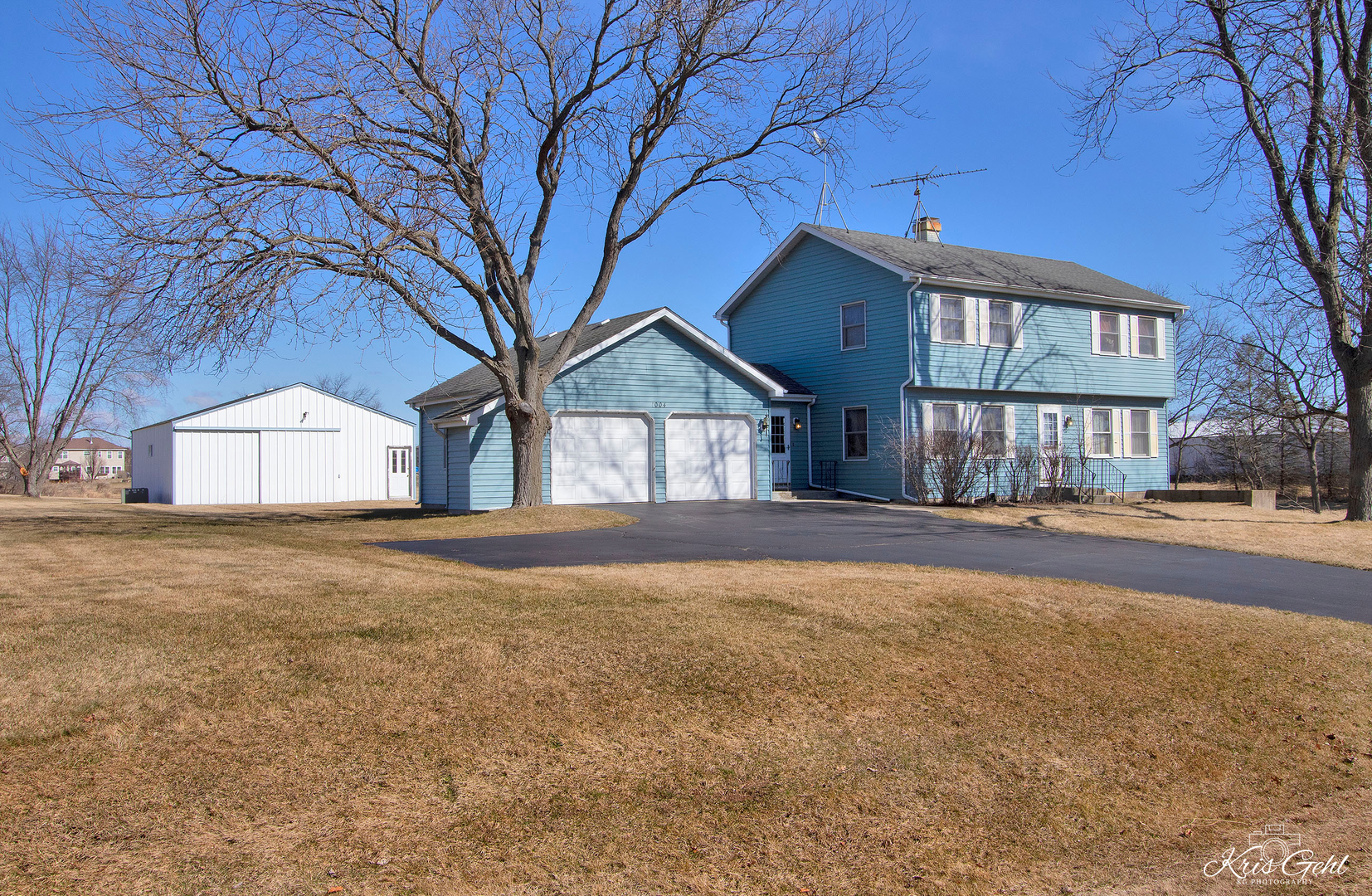 a view of a house with a yard and garage