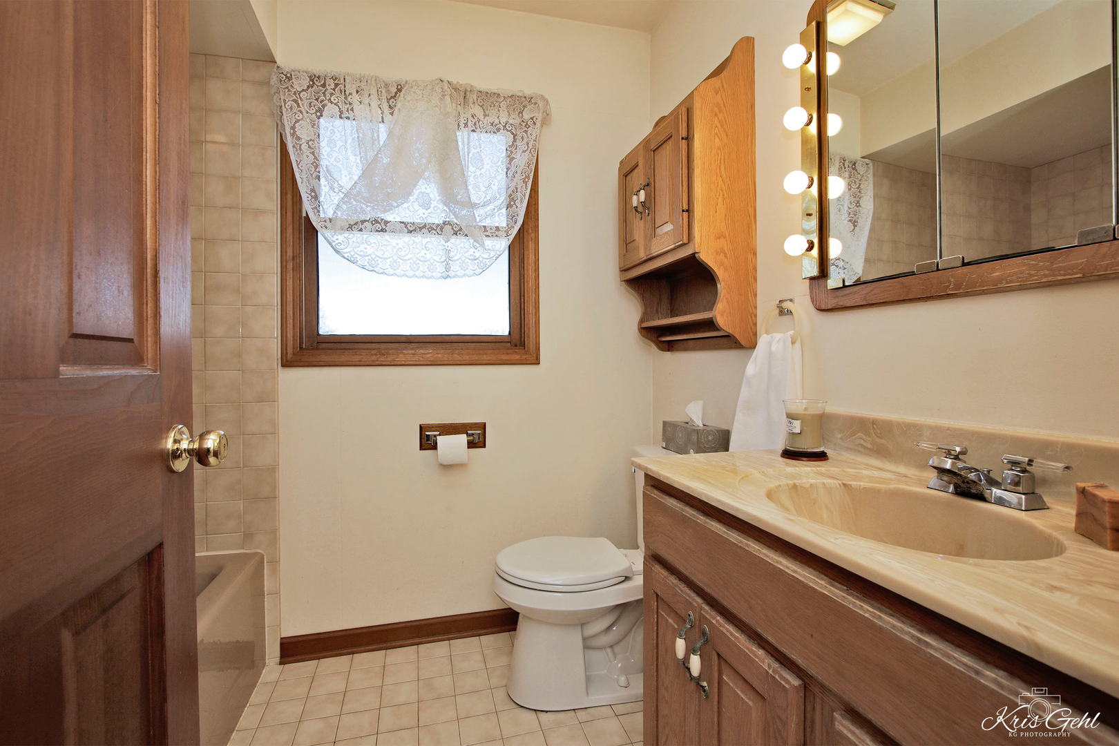 1004 Paddock Road Spring Grove, IL 60081 - Photo 13 of 26 a bathroom with a granite countertop sink a toilet and a mirror