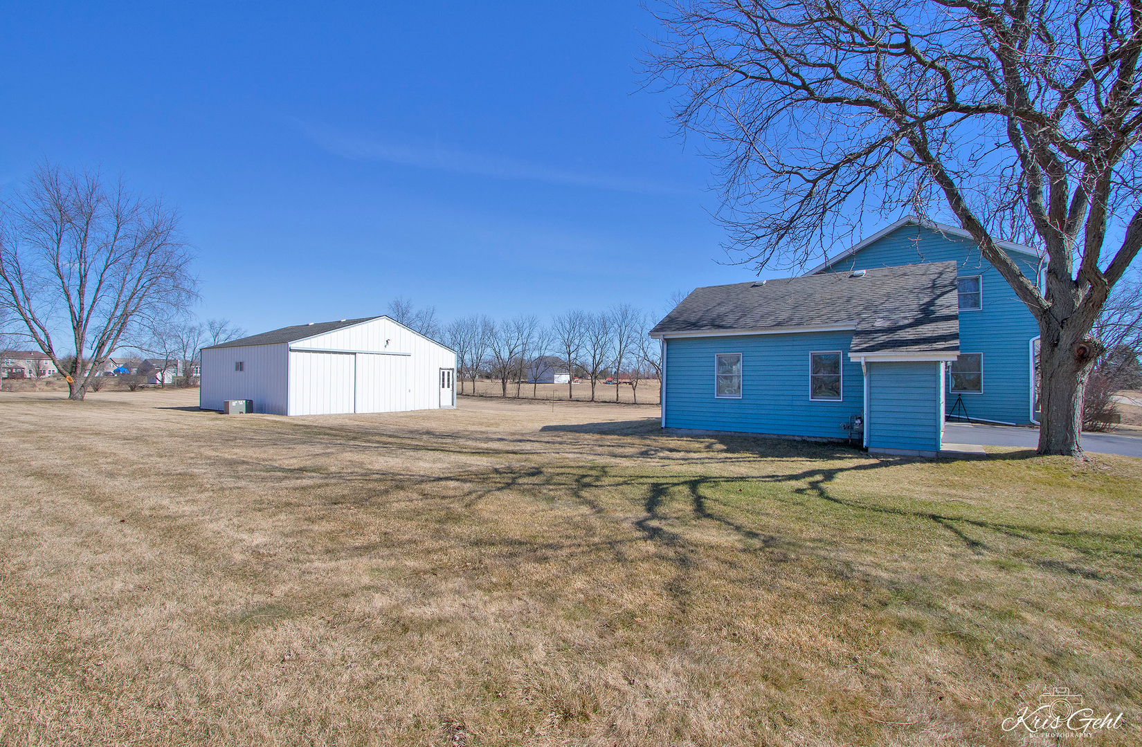 1004 Paddock Road Spring Grove, IL 60081 - Photo 18 of 26 a house with trees in front of it