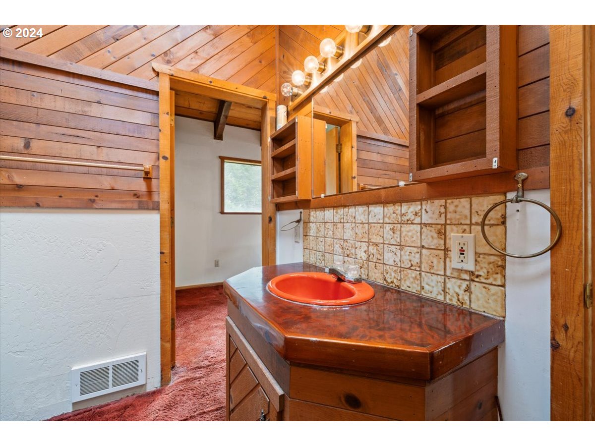 18668 Ranch Road Brookings, OR 97415 - Photo 25 of 48 a bathroom with a sink and a shower