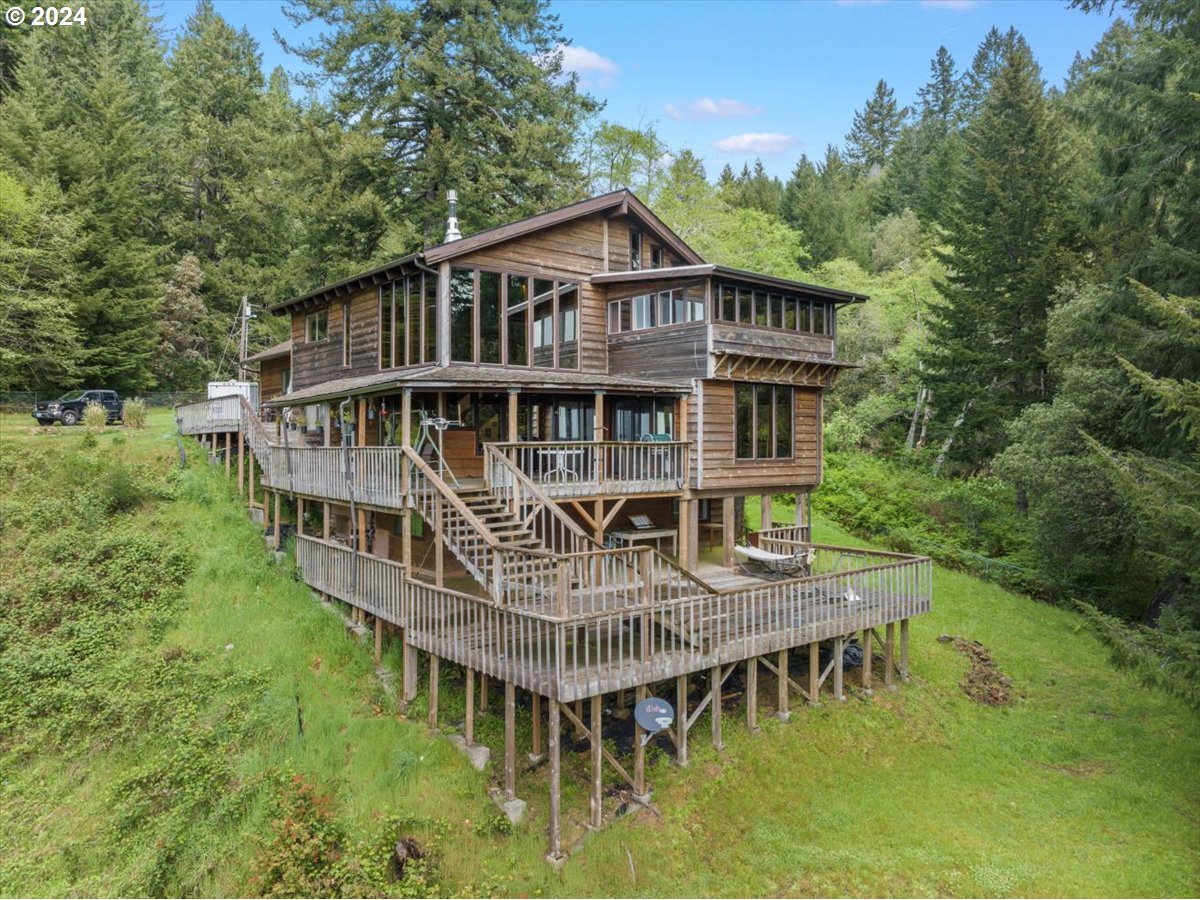18668 Ranch Road Brookings, OR 97415 - Photo 3 of 48 an aerial view of a house with roof deck