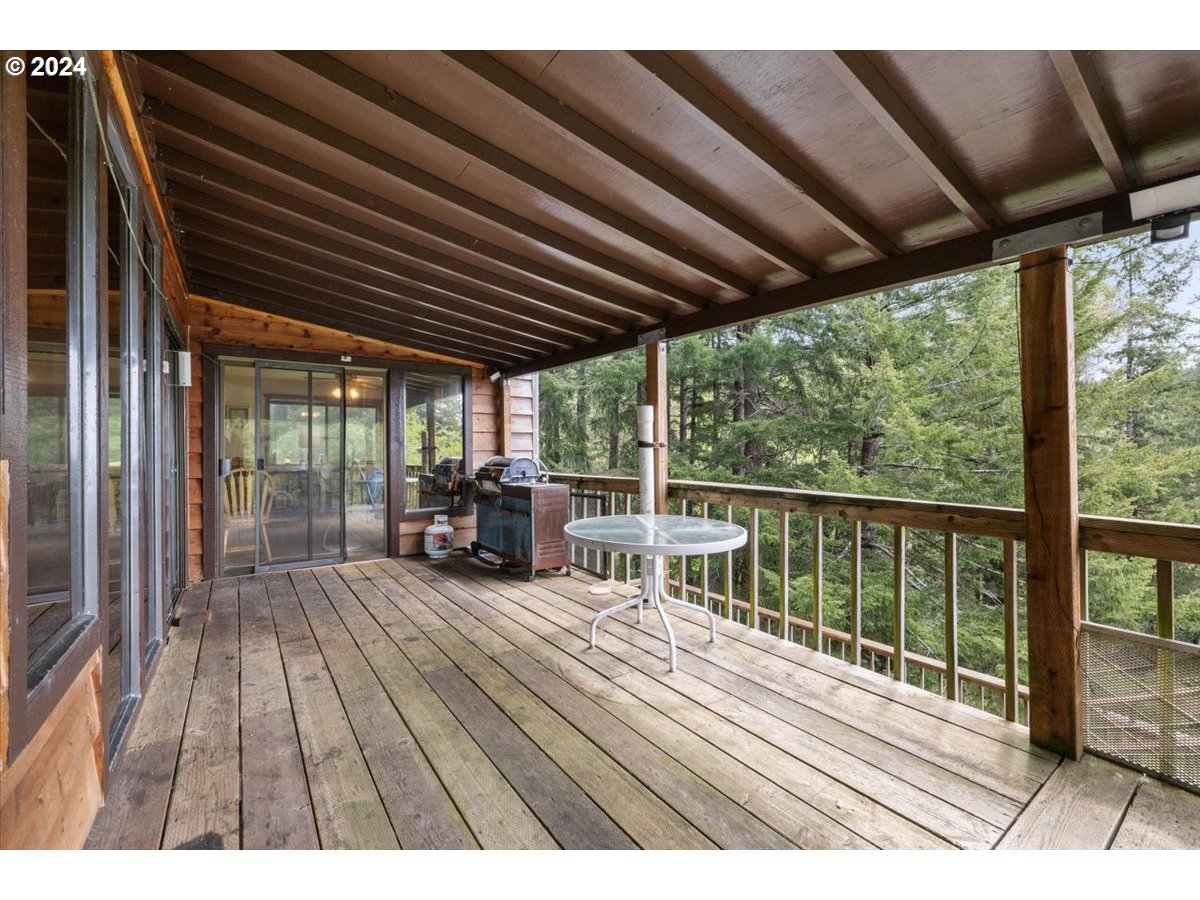 18668 Ranch Road Brookings, OR 97415 - Photo 10 of 48 a view of a patio with wooden floor