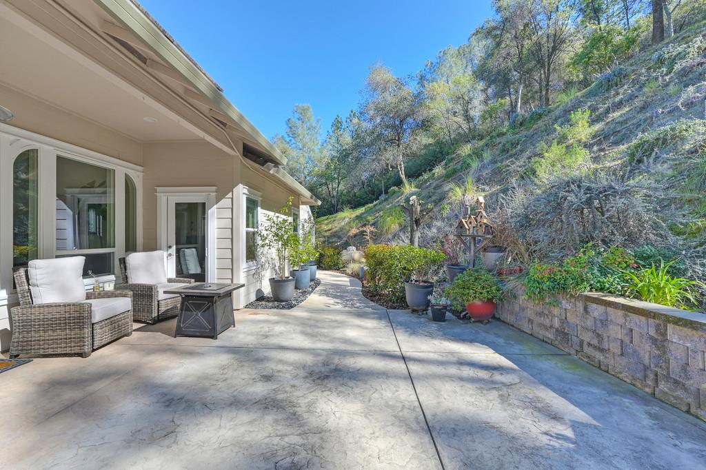 3254 Clark Street Placerville, CA 95667 - Photo 44 of 45 a view of a patio with couches table and chairs and potted plants