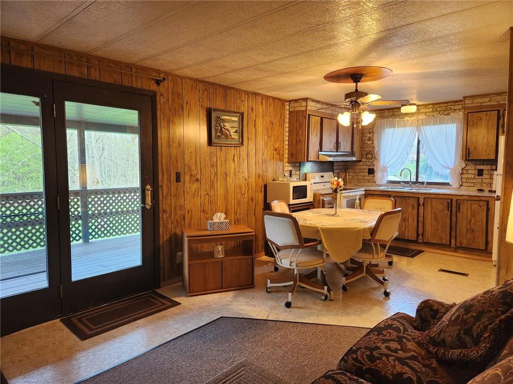 935 Rockdale Road Butler, PA 16002 - Photo 11 of 34 a living room with furniture a large window and stainless steel appliances