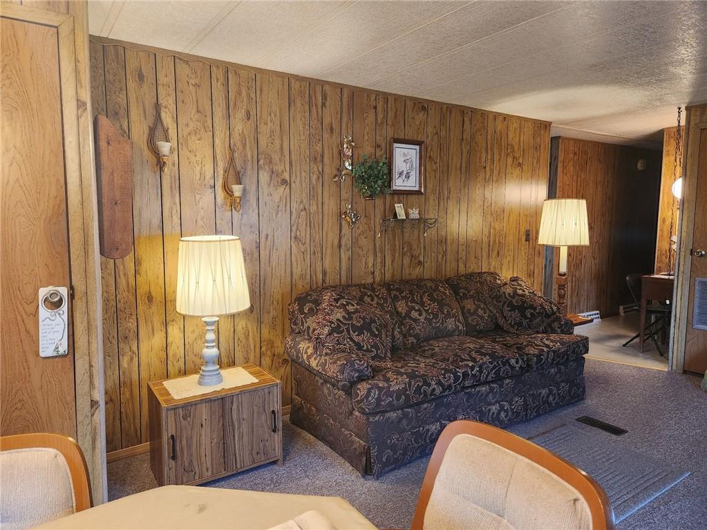 935 Rockdale Road Butler, PA 16002 - Photo 14 of 34 a living room with furniture and a lamp