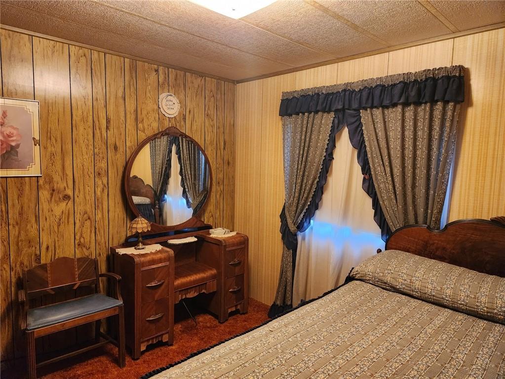 935 Rockdale Road Butler, PA 16002 - Photo 20 of 34 a bedroom with a bed and a mirror