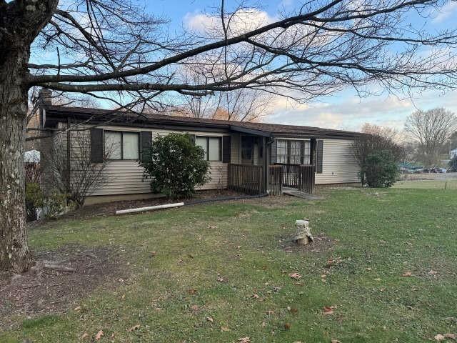 935 Rockdale Road Butler, PA 16002 - Photo 2 of 34 a front view of a house with garden