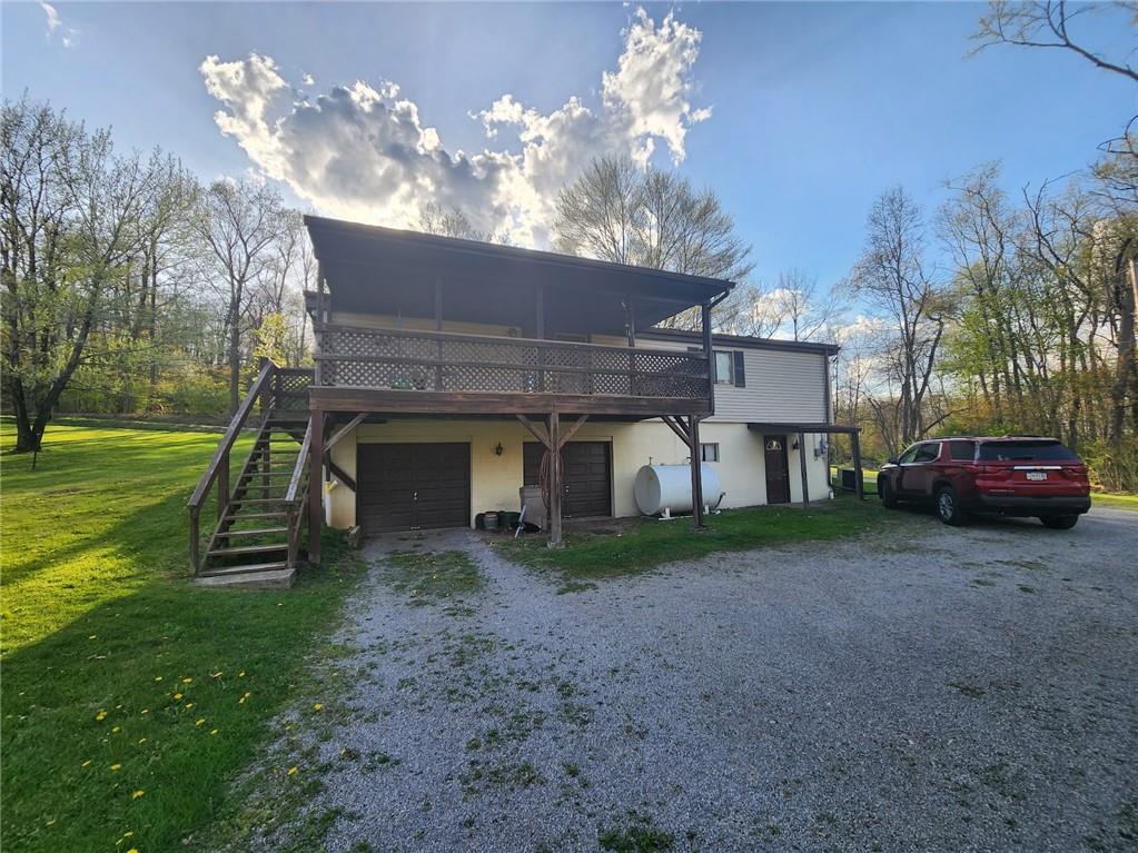 935 Rockdale Road Butler, PA 16002 - Photo 31 of 34 a view of a house with a back yard