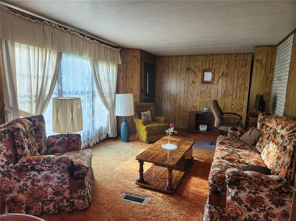 935 Rockdale Road Butler, PA 16002 - Photo 5 of 34 a living room with furniture and a window