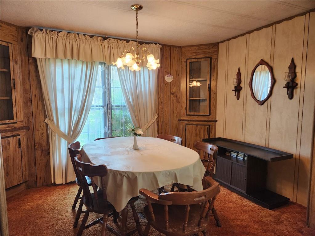 935 Rockdale Road Butler, PA 16002 - Photo 7 of 34 a view of a dining room with furniture window and wooden floor