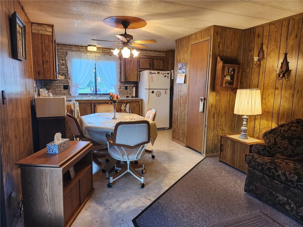 935 Rockdale Road Butler, PA 16002 - Photo 10 of 34 a living room with couches chairs and kitchen view with wooden floor