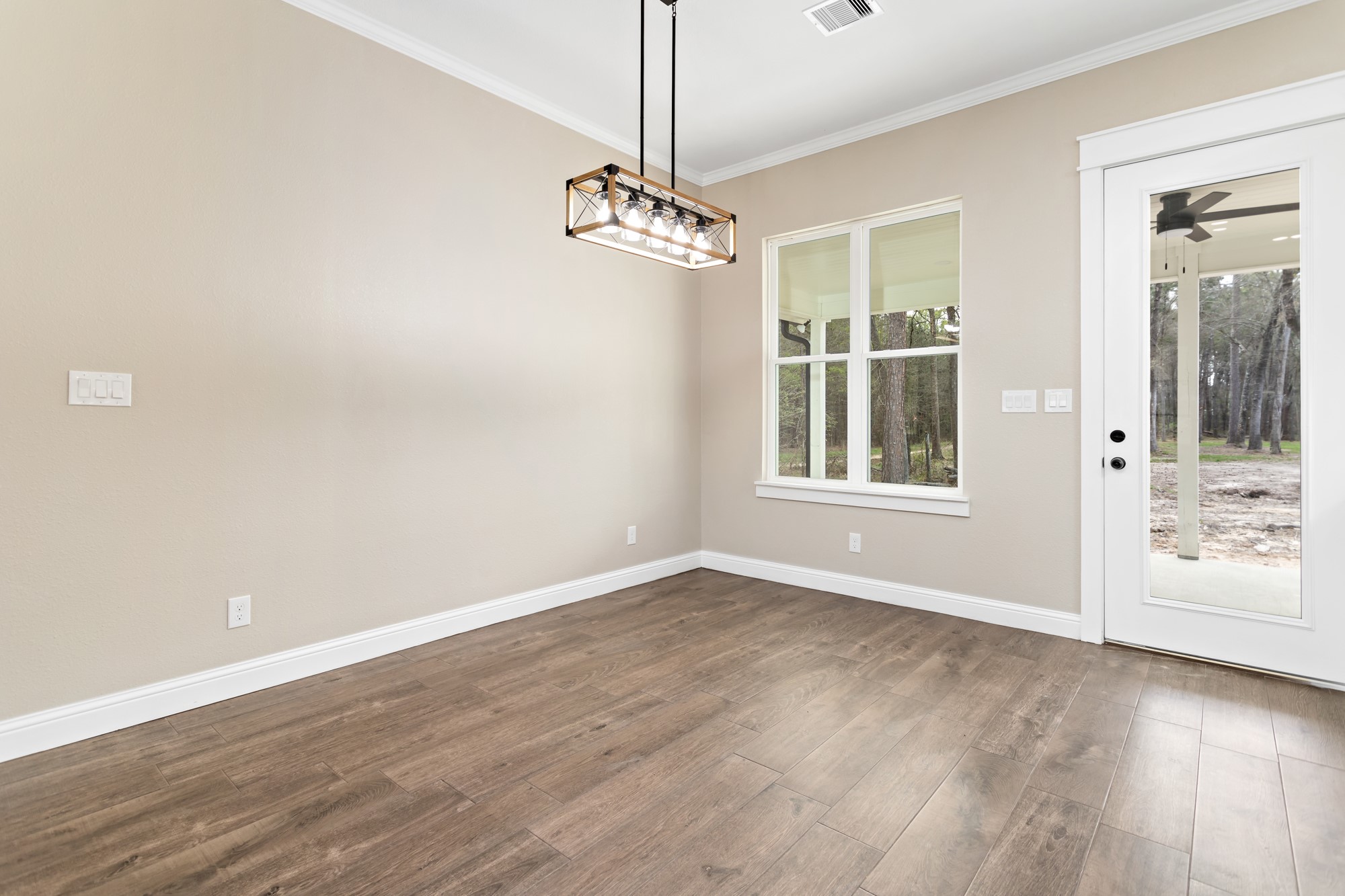 1130 Lyndale Street Vidor, TX 77662 - Photo 15 of 44 a view of an empty room with a window and wooden floor