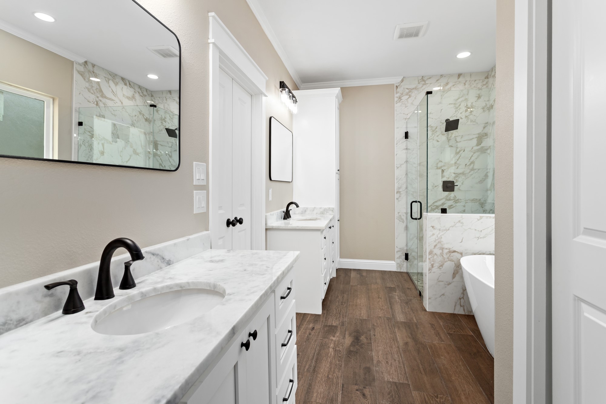 1130 Lyndale Street Vidor, TX 77662 - Photo 29 of 44 a bathroom with a double vanity sink a mirror a glass door a shower and vanity