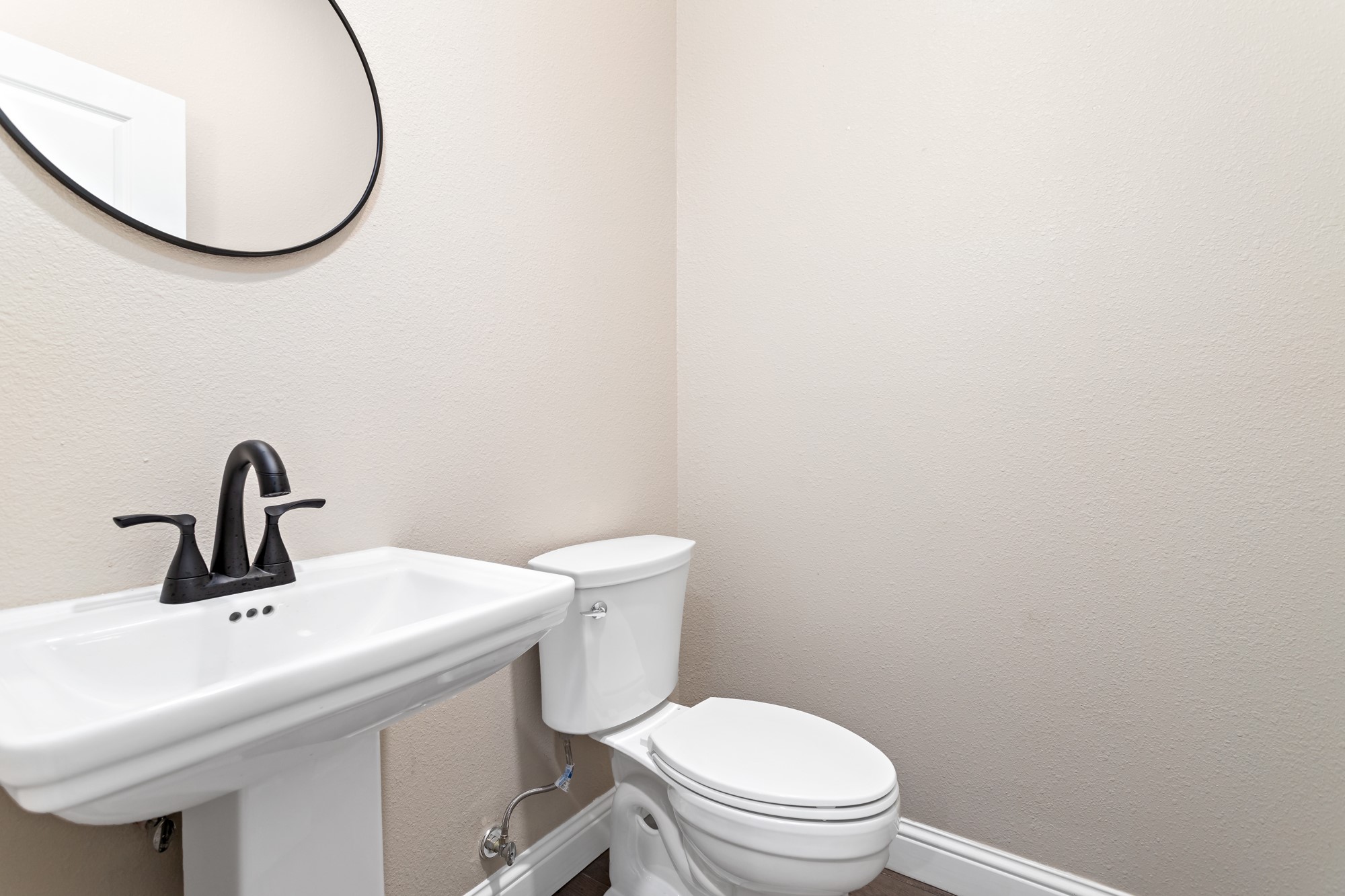 1130 Lyndale Street Vidor, TX 77662 - Photo 35 of 44 a bathroom with a sink a mirror and a toilet