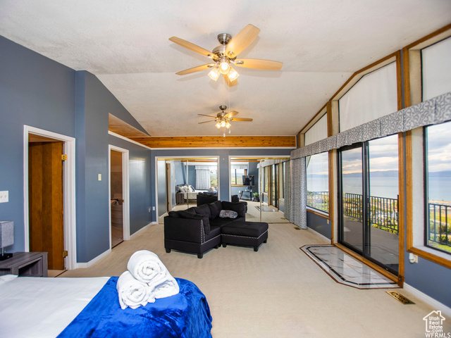 588 Raspberry Patch Road Garden City, UT 84028 - Photo 24 of 74 Carpeted bedroom with ceiling fan, access to outside, and lofted ceiling