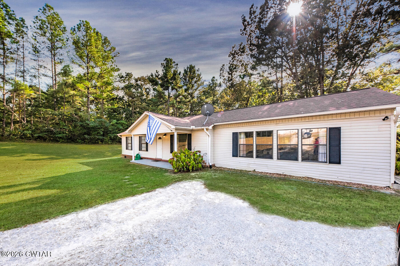 1840 Blue Goose Road Huron, TN 38345 - Photo 31 of 34 a front view of a house with a yard and trees