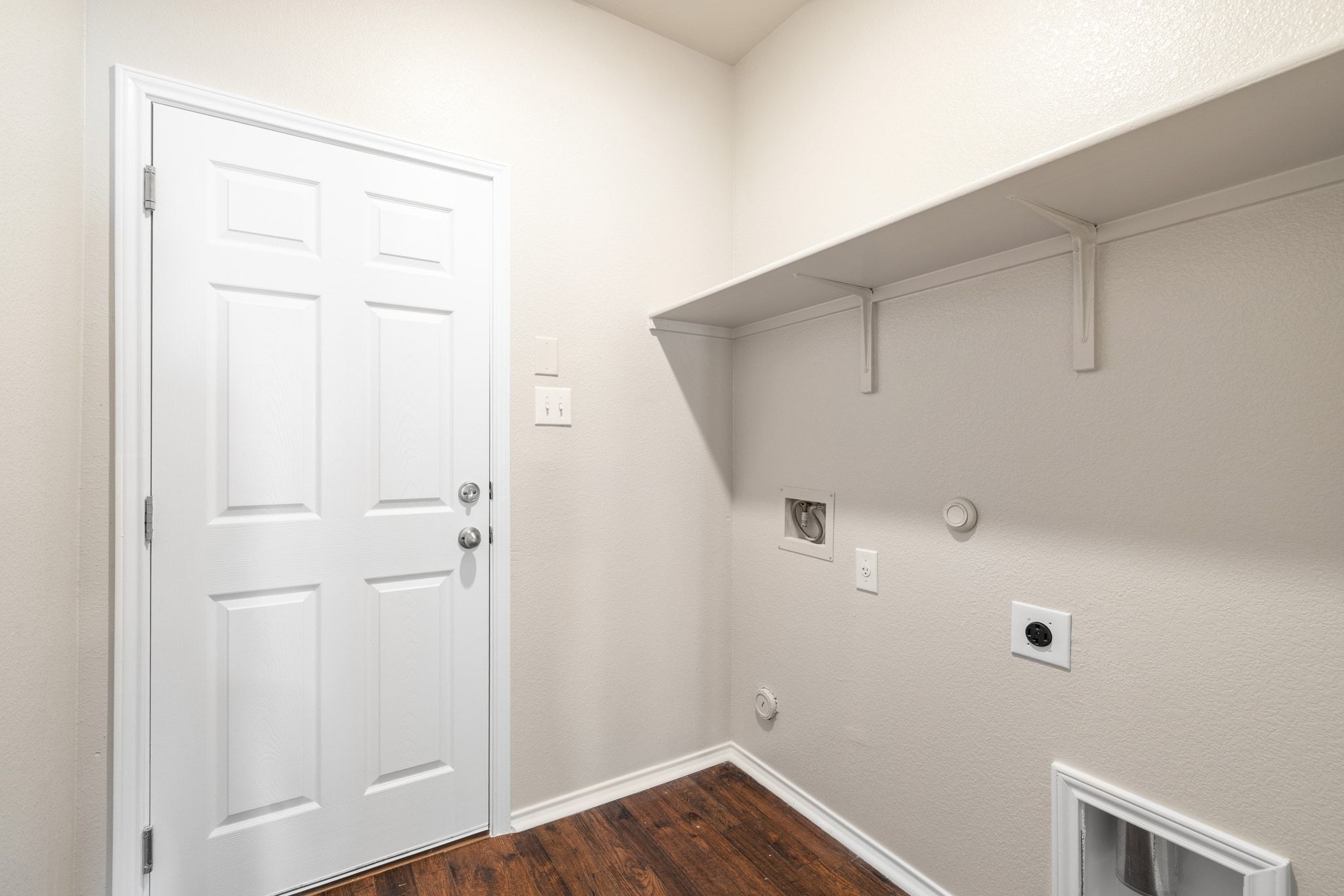 1829 Stringer Pass Leander, TX 78641 - Photo 14 of 36 Laundry area featuring gas dryer hookup, dark wood finished floors, washer hookup, and hookup for an electric dryer