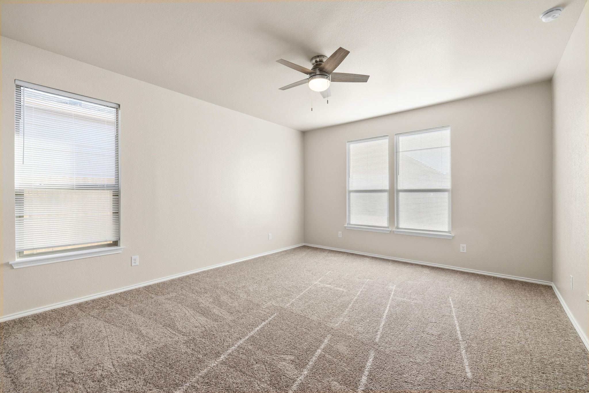 1829 Stringer Pass Leander, TX 78641 - Photo 15 of 36 Unfurnished room with ceiling fan and light carpet