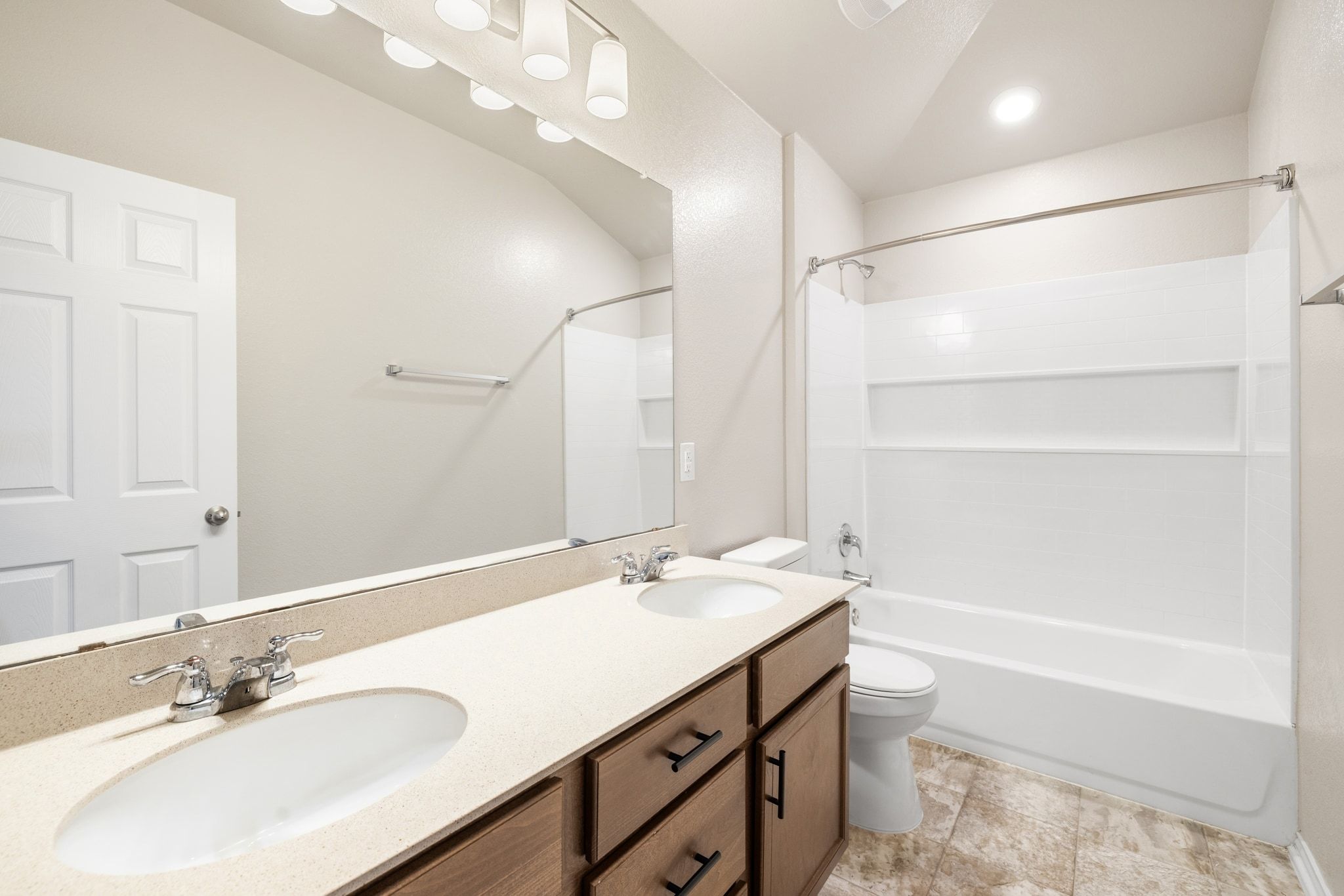 1829 Stringer Pass Leander, TX 78641 - Photo 21 of 36 Bathroom with double vanity and shower / washtub combination
