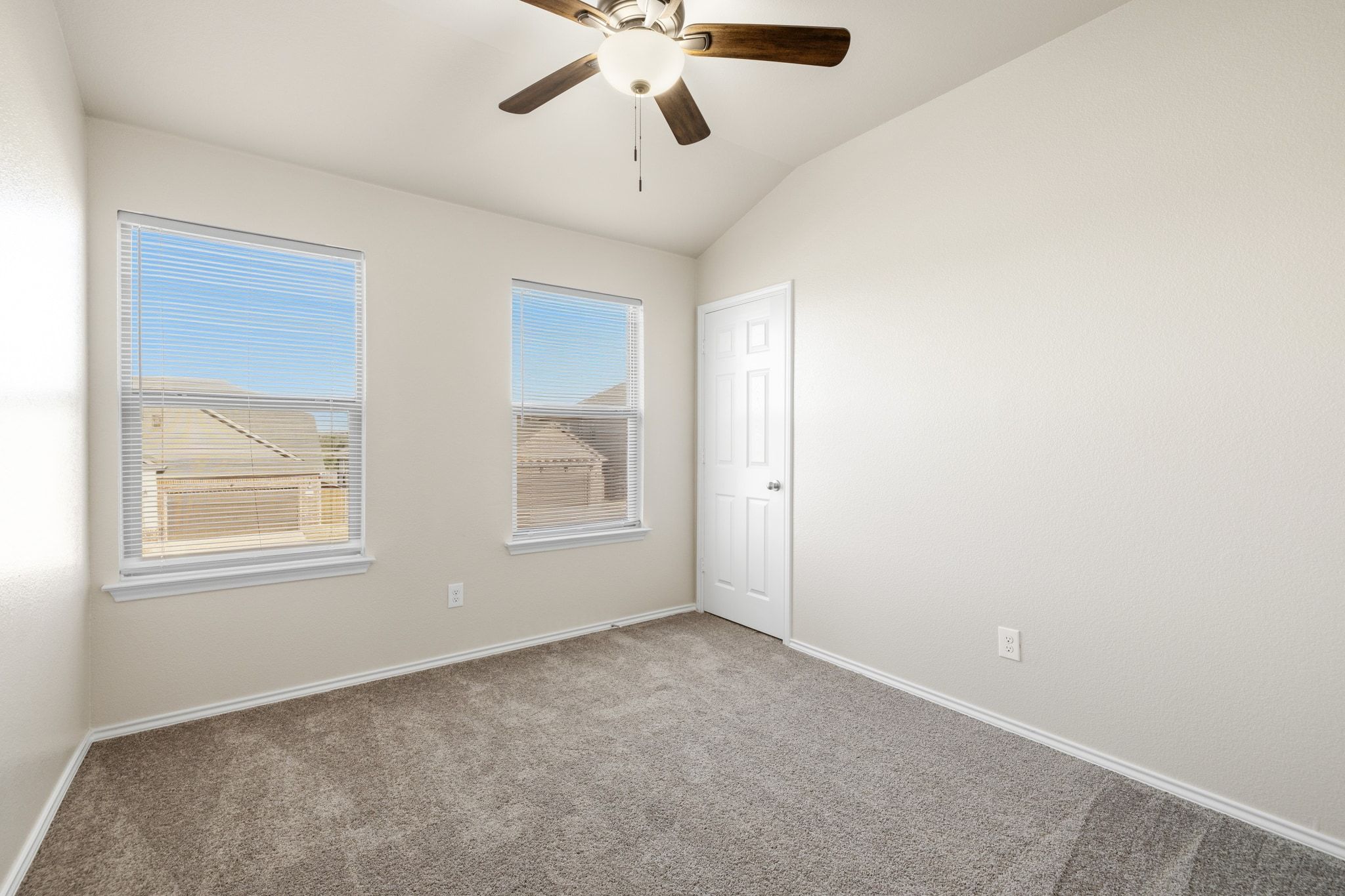 1829 Stringer Pass Leander, TX 78641 - Photo 22 of 36 Unfurnished room with a ceiling fan, carpet floors, and lofted ceiling