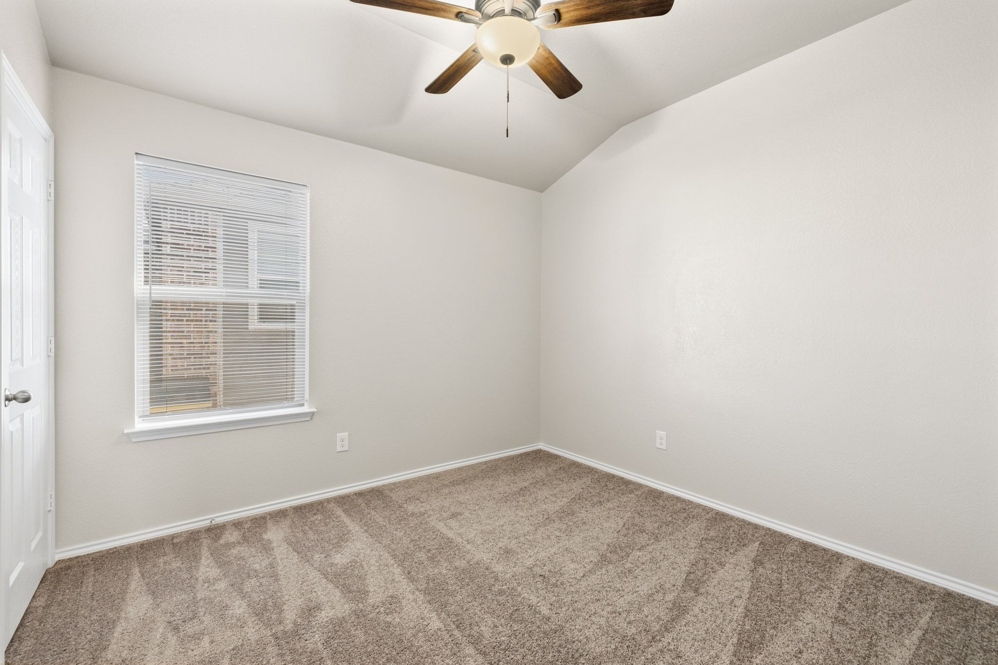 1829 Stringer Pass Leander, TX 78641 - Photo 23 of 36 Carpeted empty room featuring lofted ceiling and a ceiling fan