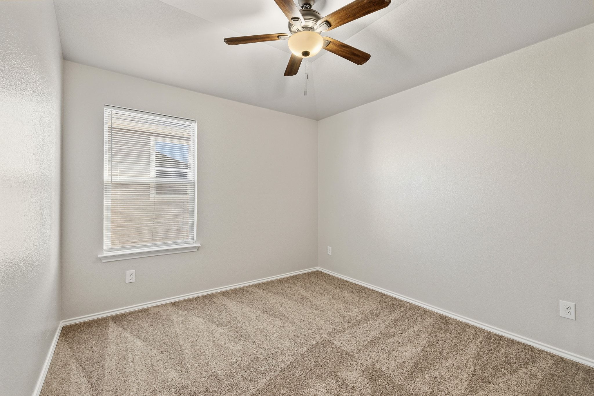 1829 Stringer Pass Leander, TX 78641 - Photo 24 of 36 Empty room featuring carpet flooring and ceiling fan