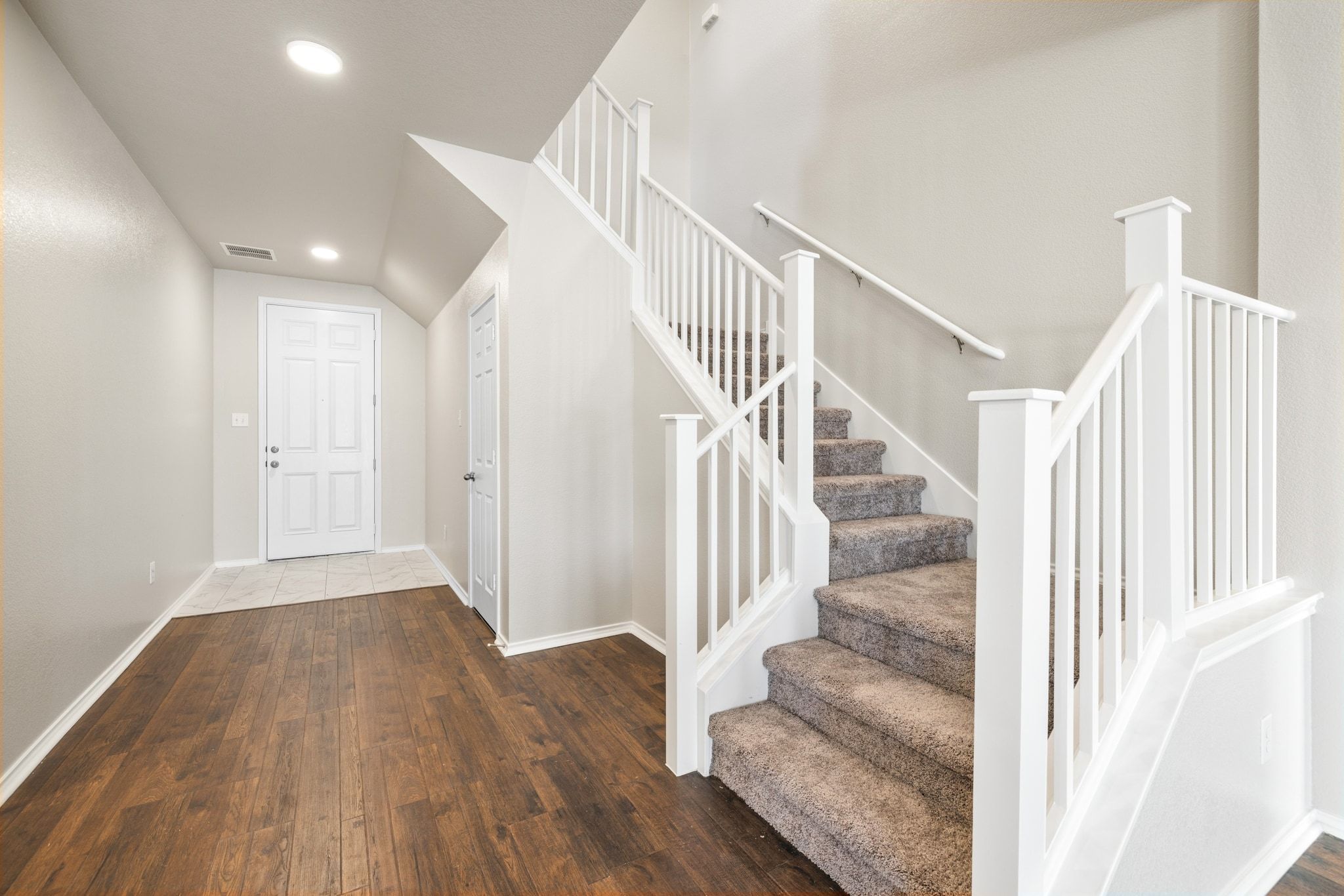 1829 Stringer Pass Leander, TX 78641 - Photo 5 of 36 Entrance foyer featuring dark wood-style flooring and recessed lighting