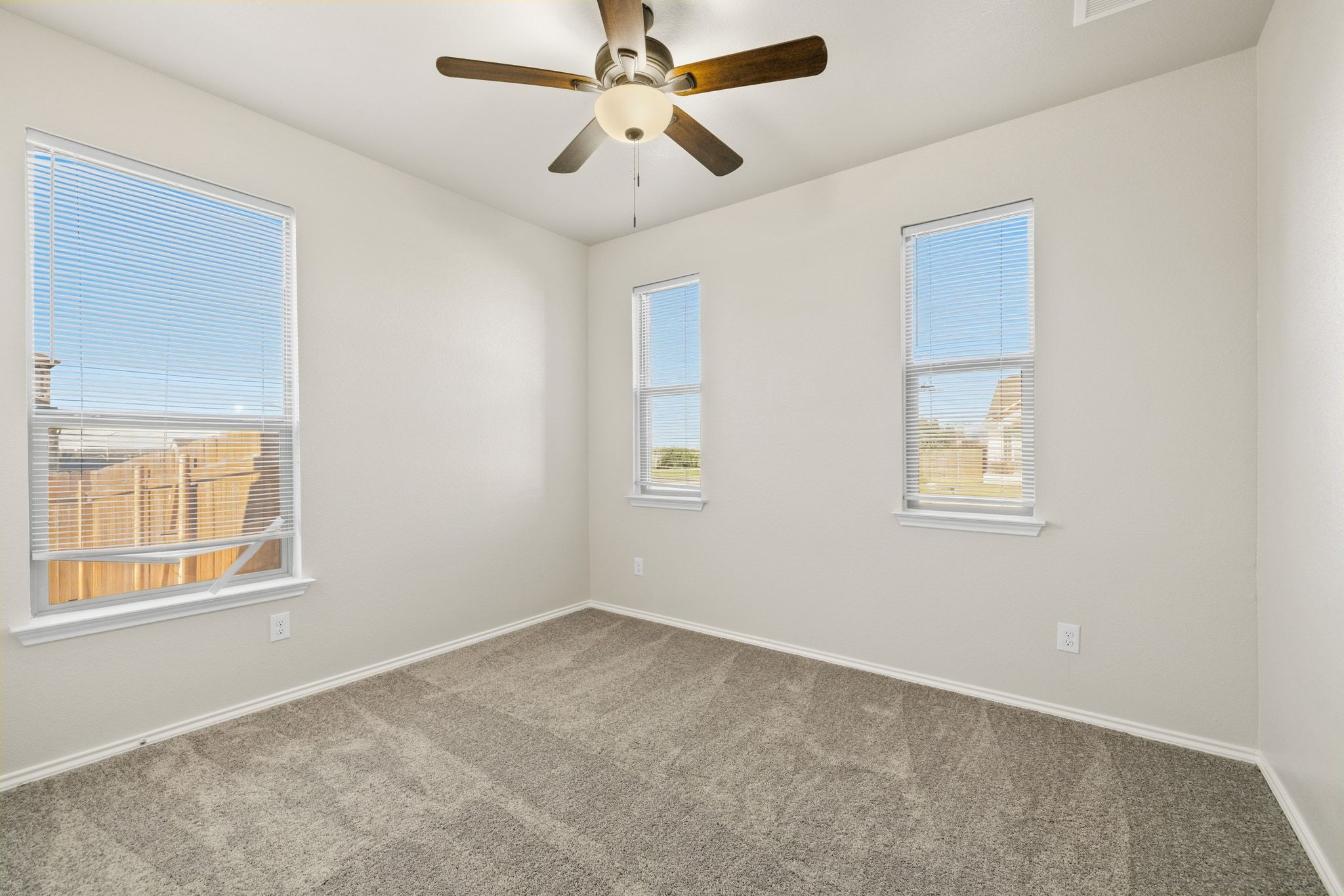 1829 Stringer Pass Leander, TX 78641 - Photo 6 of 36 Unfurnished room with ceiling fan and carpet